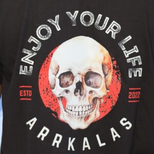A bold T-shirt design from Arrkalas featuring a flaming skull in a red circle with the words “ENJOY YOUR LIFE” in gritty white font. Below, it reads “ARRKALAS” and the established year 2022, reflecting a fierce, rebellious attitude