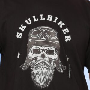 A brutal biker skull with a battle-worn helmet and fierce beard leads the outlaw ride. This “Skullbiker Motorcycle Club” tee by Arrkalas roars with raw power and road-born rebellion