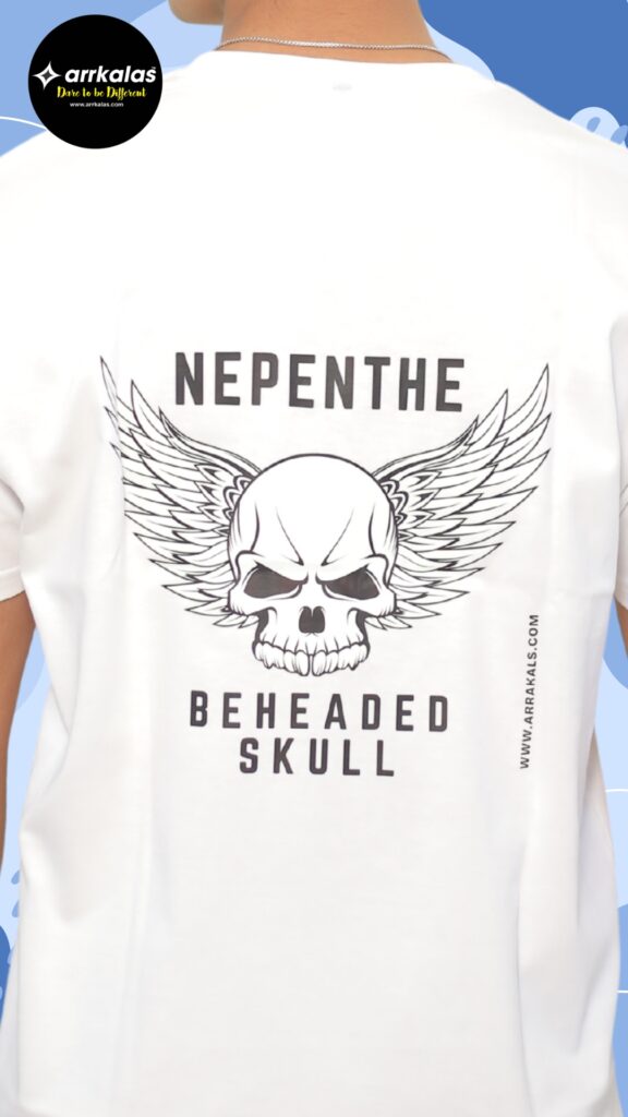 A fierce winged skull stares with cold rage, crowned by the word “NEPENTHE” — a symbol of dark escape. Below, “BEHEADED SKULL” dares you to face rebellion with no mercy and no return
