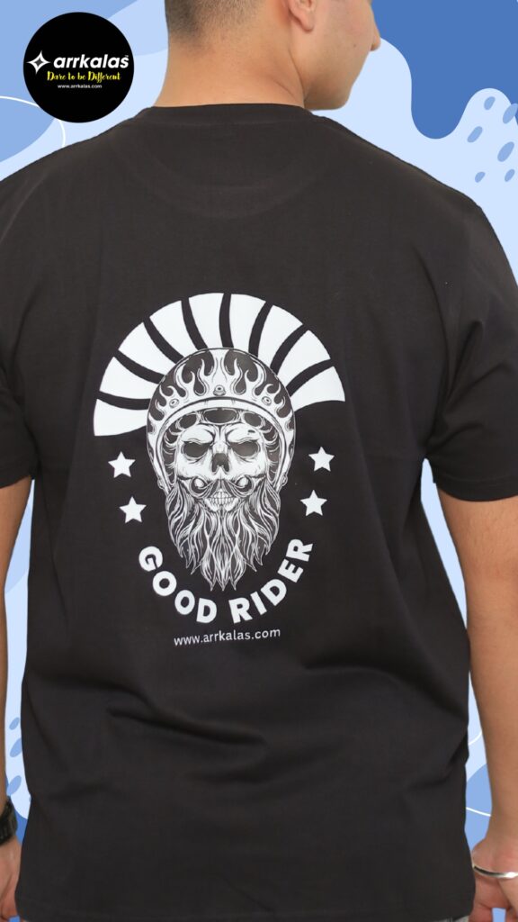 A fierce back print featuring a flaming-bearded skull crowned with blazing rays, surrounded by stars and the bold phrase “GOOD RIDER.” This Arrkalas tee screams rebel energy — where dark mythology meets biker soul at full throttle
