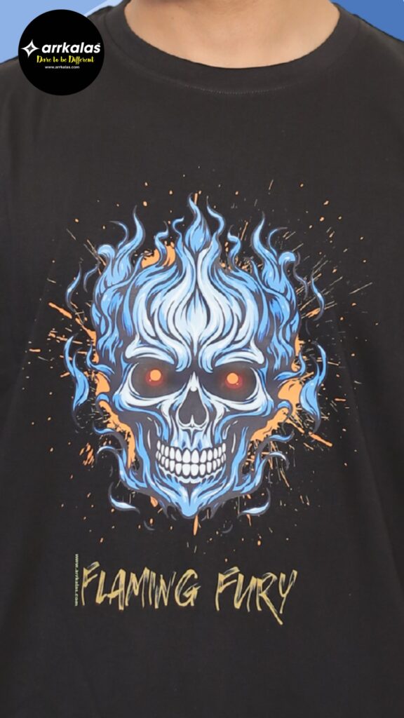 A blazing blue skull with fiery red eyes erupts in electric flames and sparks, radiating fierce rebellion and raw energy. This “Flaming Fury” design on a dark tee from Arrkalas screams chaos, power, and untamed fire from the dark side