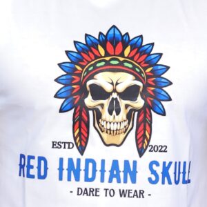 Bold and savage skull wearing a fierce tribal feather crown, blazing in red, blue, and gold—marked with raw rebellion. “RED INDIAN SKULL – DARE TO WEAR” ignites fearless attitude on this striking tee