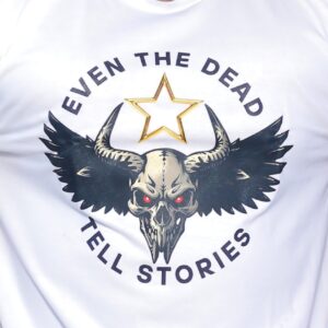 Horned skull with wings and red eyes under a golden star, declaring “Even the Dead Tell Stories.” A fierce symbol of untold dark power