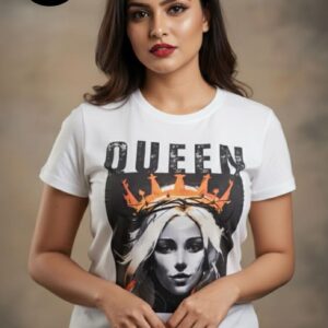 Woman wearing a white T-shirt with bold “QUEEN” lettering above a vibrant graphic of a crowned figure, blending grunge and regal aesthetics