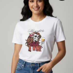 Trendy women’s white T-shirt by Arrkalas featuring a bold graphic of a stylish skull-faced woman with flowing brown hair, pink flowers, and a glass of wine, captioned “This might be a wine.” A unique blend of gothic art and modern humor, perfect for confident women who love statement fashion