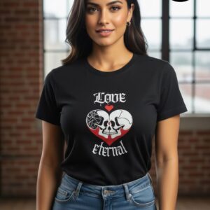 A stylish woman with long, flowing hair wears a black T-shirt featuring a striking design: two intertwining skulls forming a heart, accented with contrasting patterns and a small red heart above. The text “Love eternal” is boldly printed, symbolizing everlasting affection and individuality